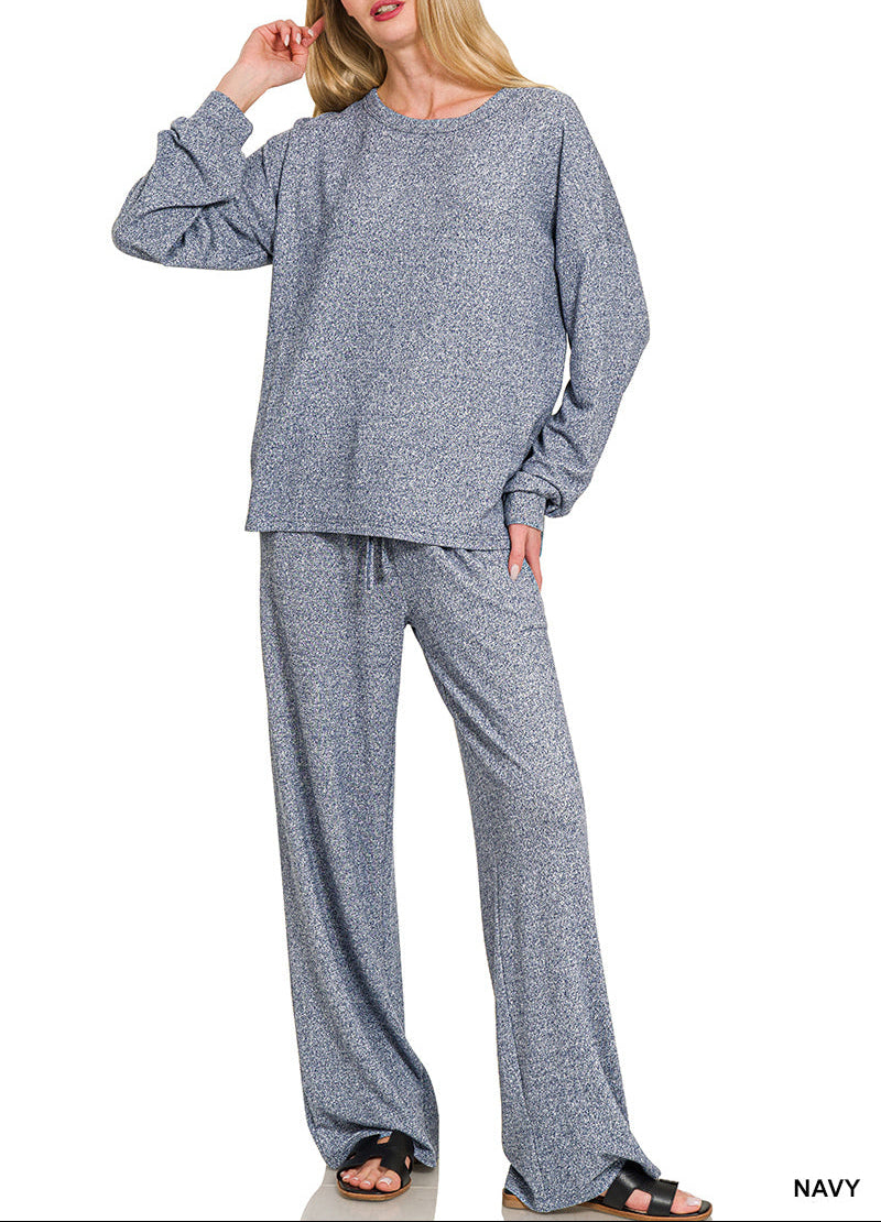 Woman wearing a 2-piece round neck top and drawstring bottom set