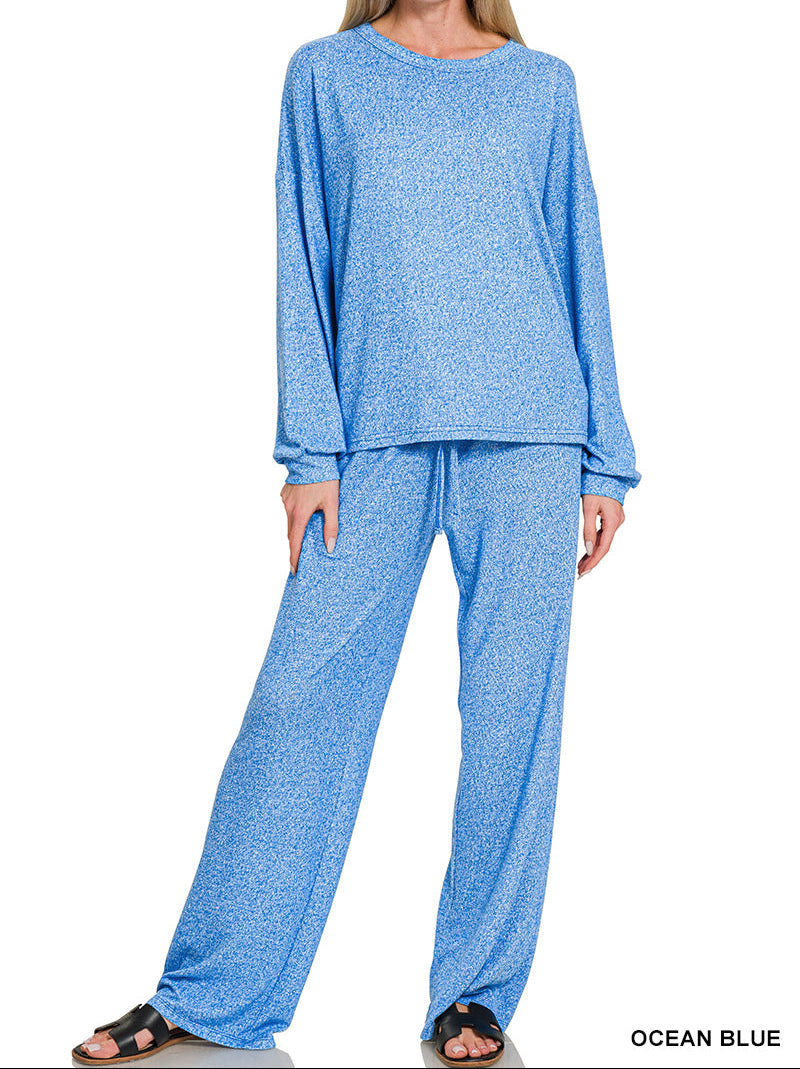 Woman wearing a 2-piece round neck top and drawstring bottom set