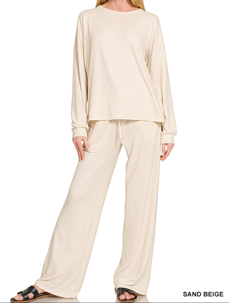 Woman wearing a 2-piece round neck top and drawstring bottom set