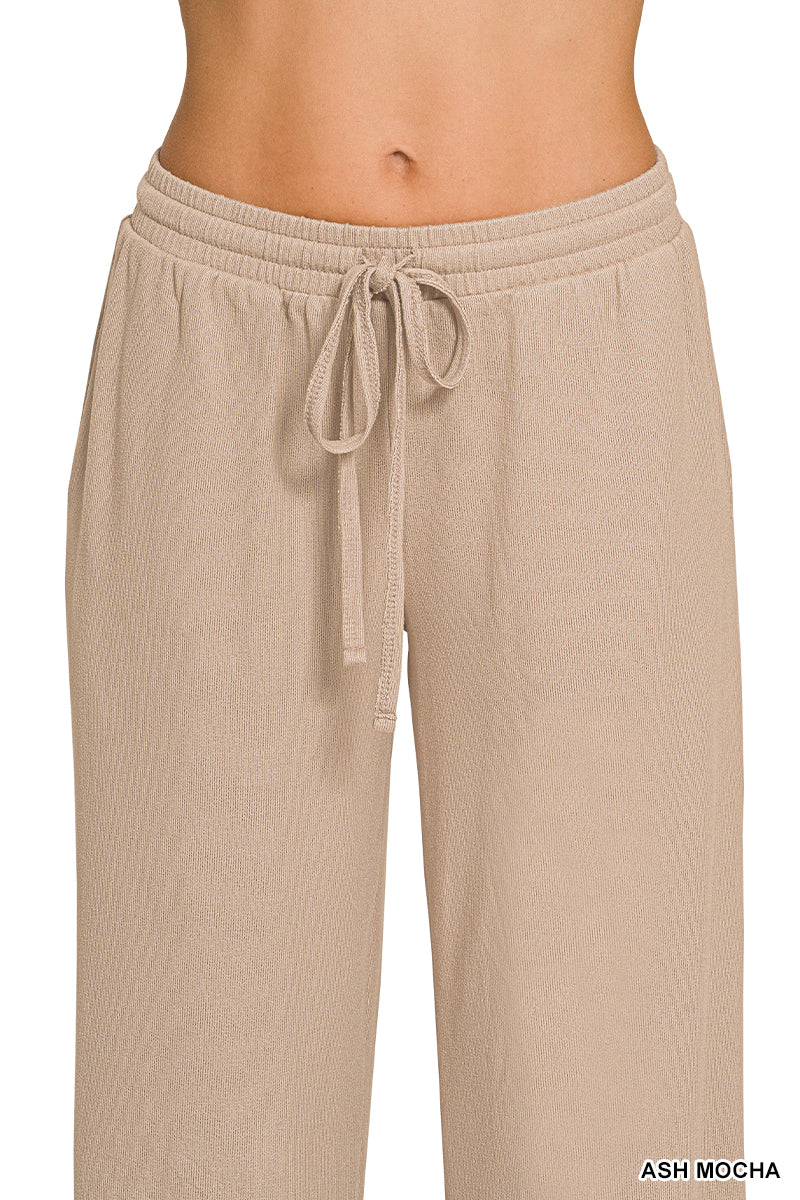 Woman wearing ash mocha pants with drawstring