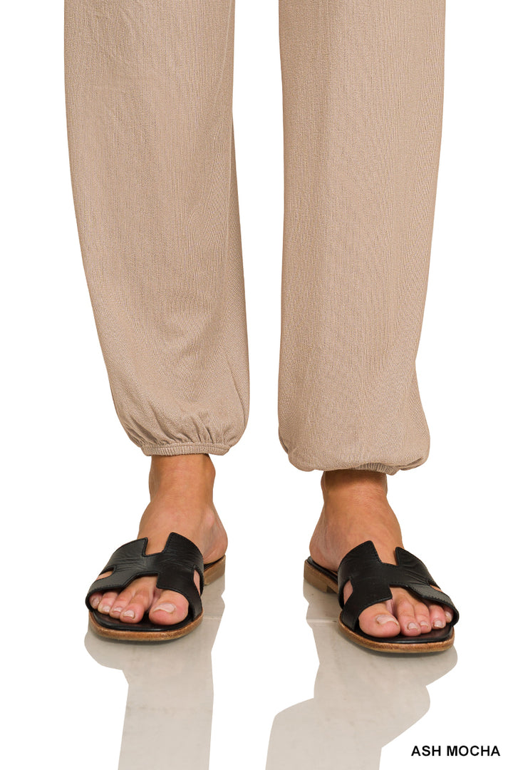 Woman wearing ash mocha pants with gathered bottom