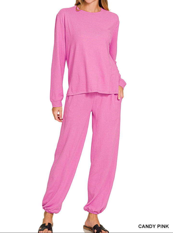 Woman wearing long sleeve top and drawstring pants set