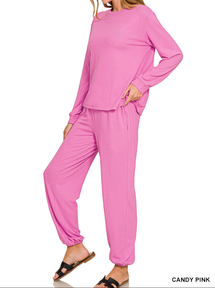 Woman wearing long sleeve top and drawstring pants set