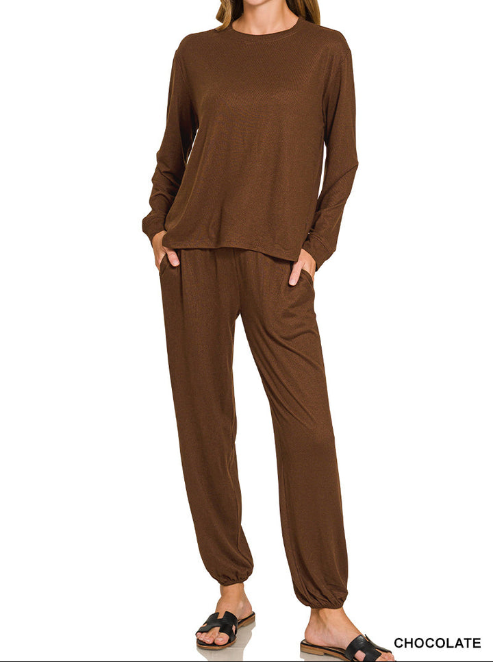 Woman wearing long sleeve top and drawstring pants set