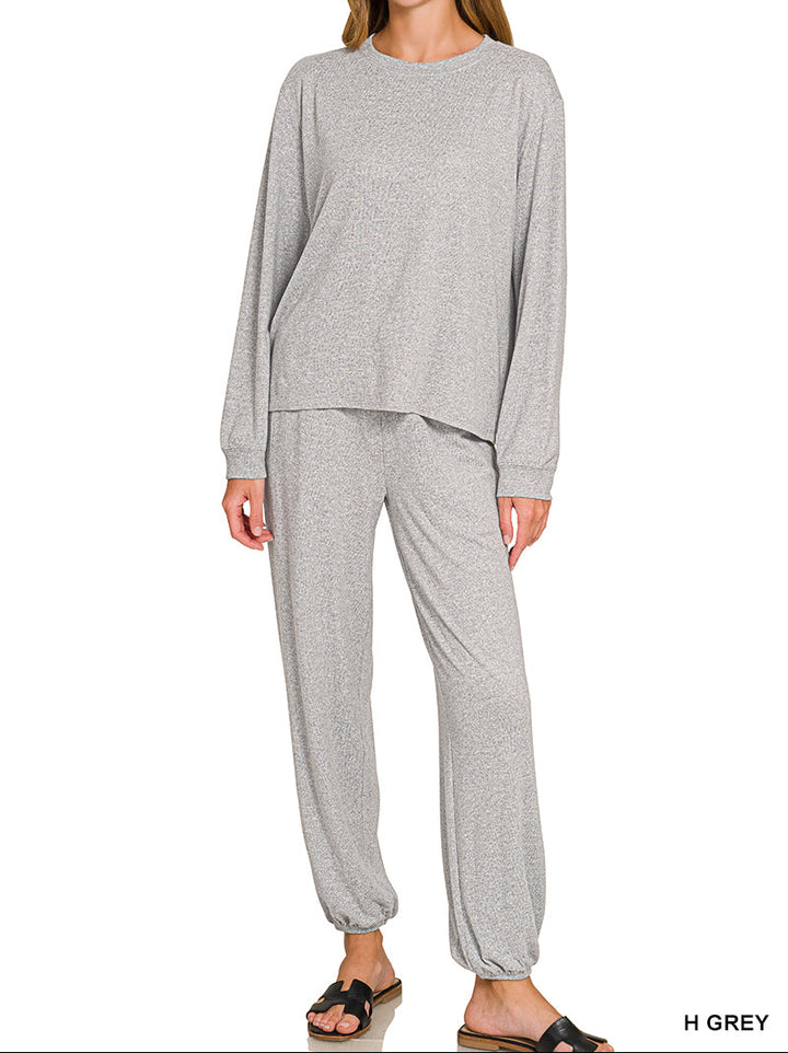 Woman wearing long sleeve top and drawstring pants set