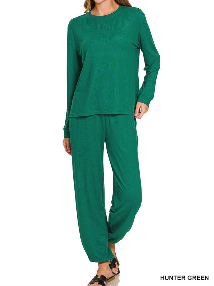 Woman wearing long sleeve top and drawstring pants set