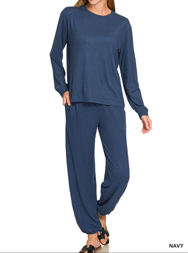 Woman wearing long sleeve top and drawstring pants set