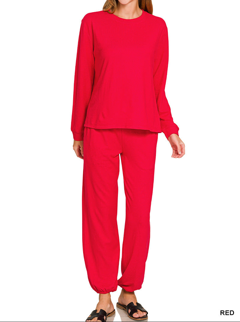 Woman wearing long sleeve top and drawstring pants set