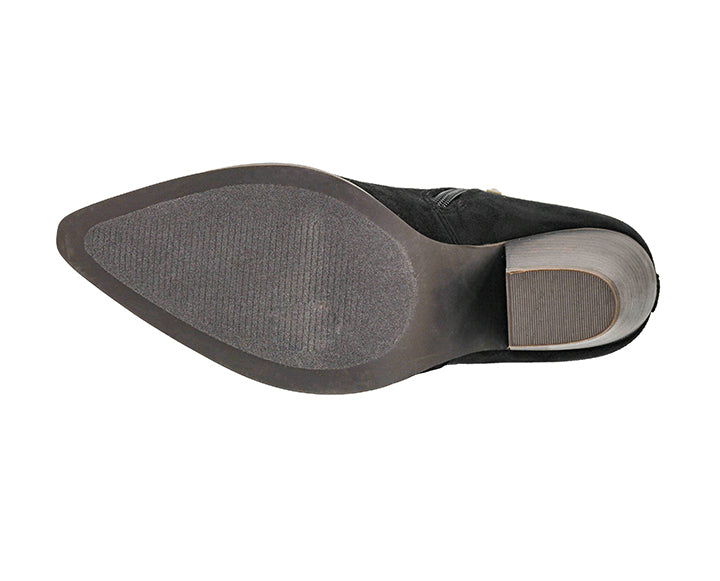 Top-down view of a black pointed-toe boot showing the textured gray outsole and a light gray heel block, isolated on a white background.