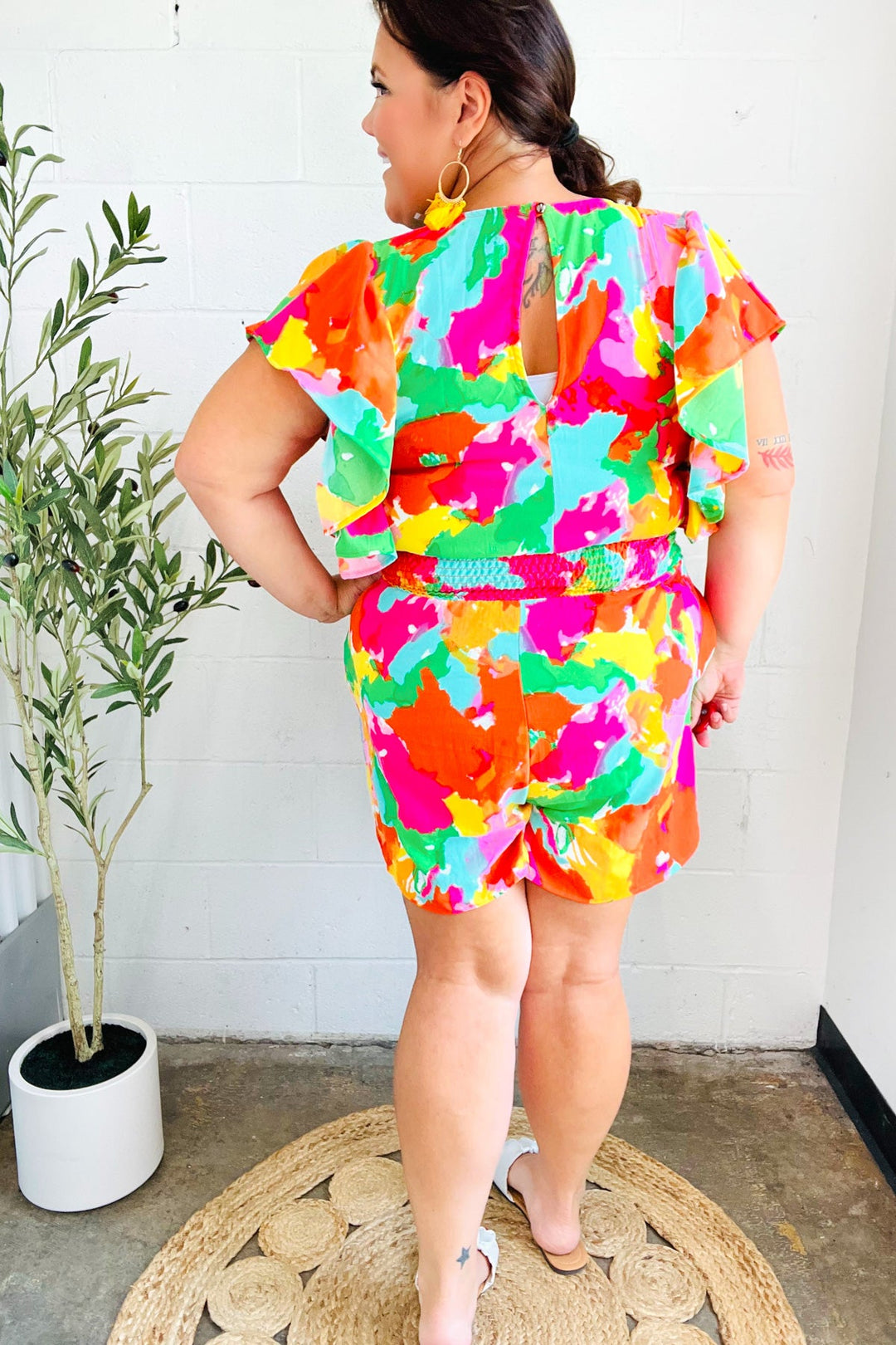 Under The Sun Abstract Floral Smocked Waist V Neck Flutter Sleeve Romper | Nikki &amp; Co. Boutique