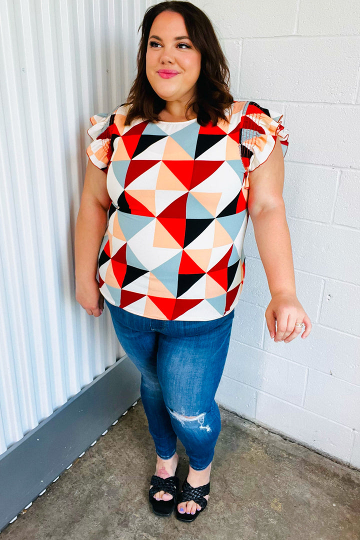 Burnt Orange Geo Print Smocked Ruffle Frill Sleeve Tops | Nikki &amp; Co. Boutique