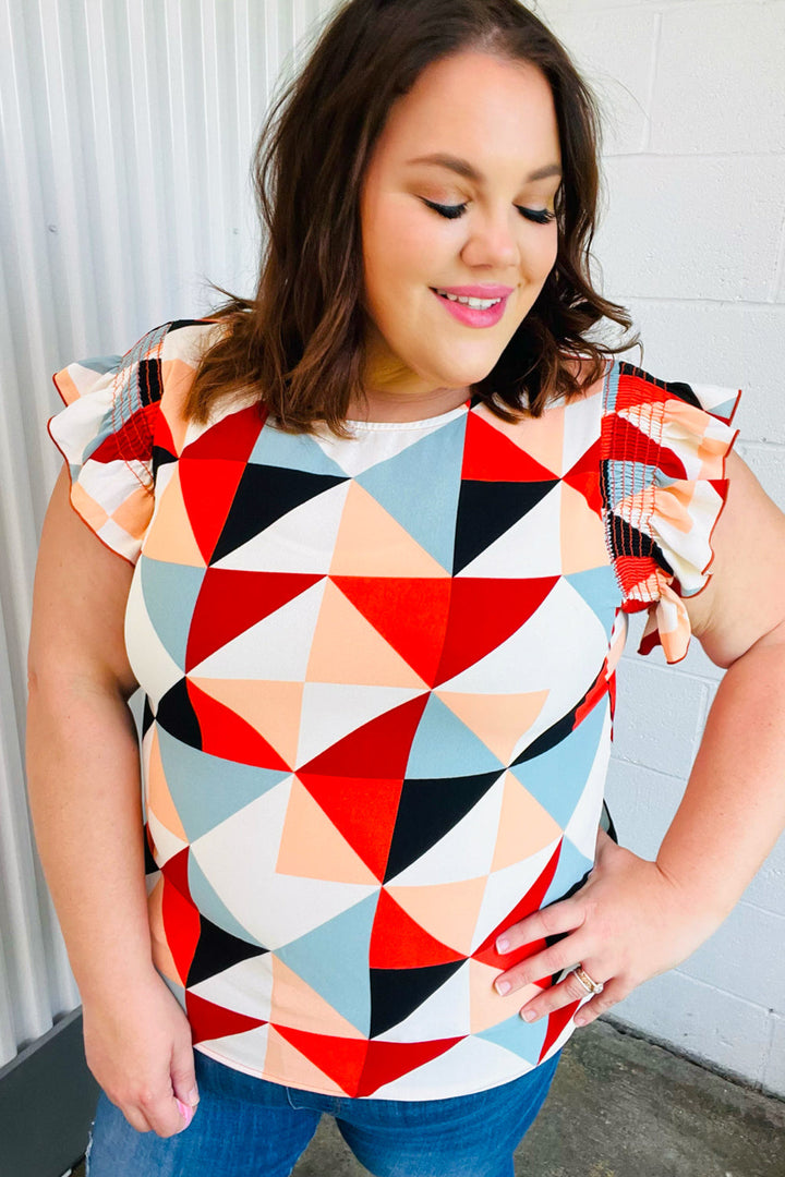 Burnt Orange Geo Print Smocked Ruffle Frill Sleeve Tops | Nikki &amp; Co. Boutique