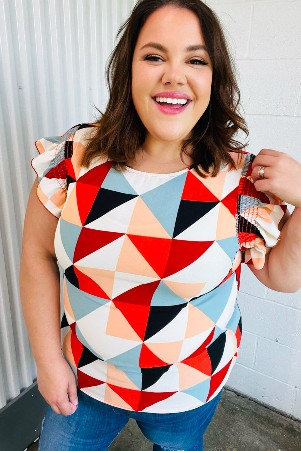 Burnt Orange Geo Print Smocked Ruffle Frill Sleeve Tops | Nikki &amp; Co. Boutique