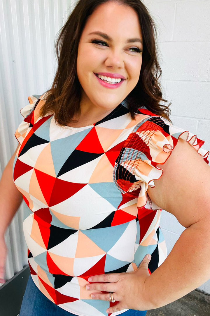 Burnt Orange Geo Print Smocked Ruffle Frill Sleeve Tops | Nikki &amp; Co. Boutique