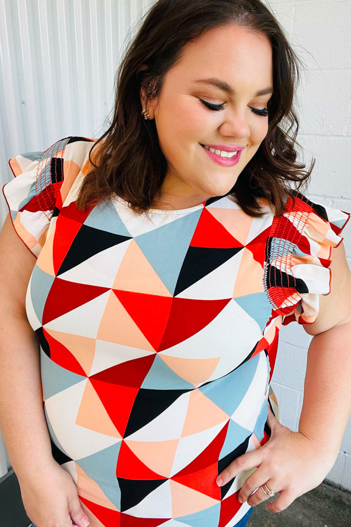 Burnt Orange Geo Print Smocked Ruffle Frill Sleeve Tops | Nikki &amp; Co. Boutique