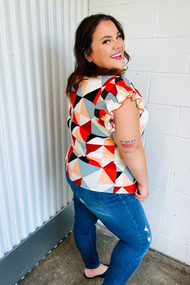 Burnt Orange Geo Print Smocked Ruffle Frill Sleeve Tops | Nikki &amp; Co. Boutique