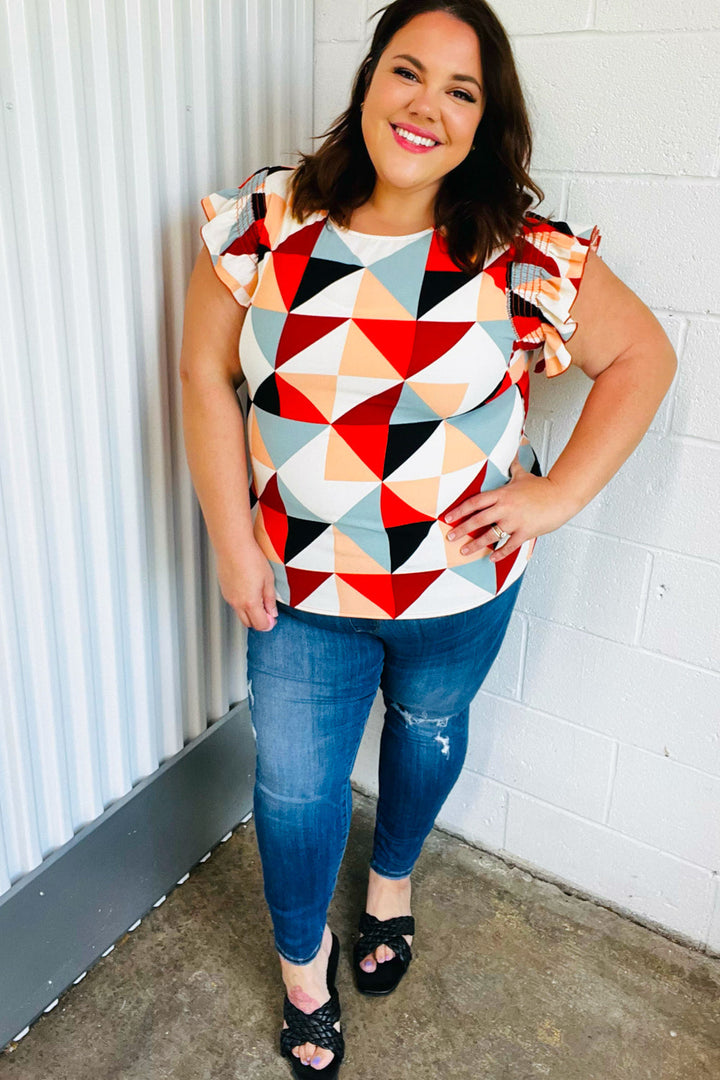 Burnt Orange Geo Print Smocked Ruffle Frill Sleeve Tops | Nikki &amp; Co. Boutique