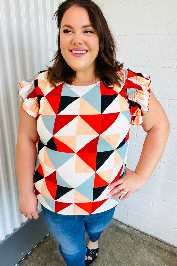 Burnt Orange Geo Print Smocked Ruffle Frill Sleeve Tops | Nikki &amp; Co. Boutique