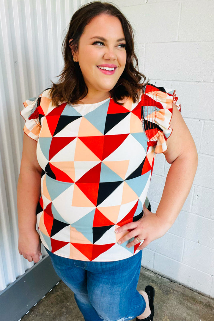 Burnt Orange Geo Print Smocked Ruffle Frill Sleeve Tops | Nikki &amp; Co. Boutique