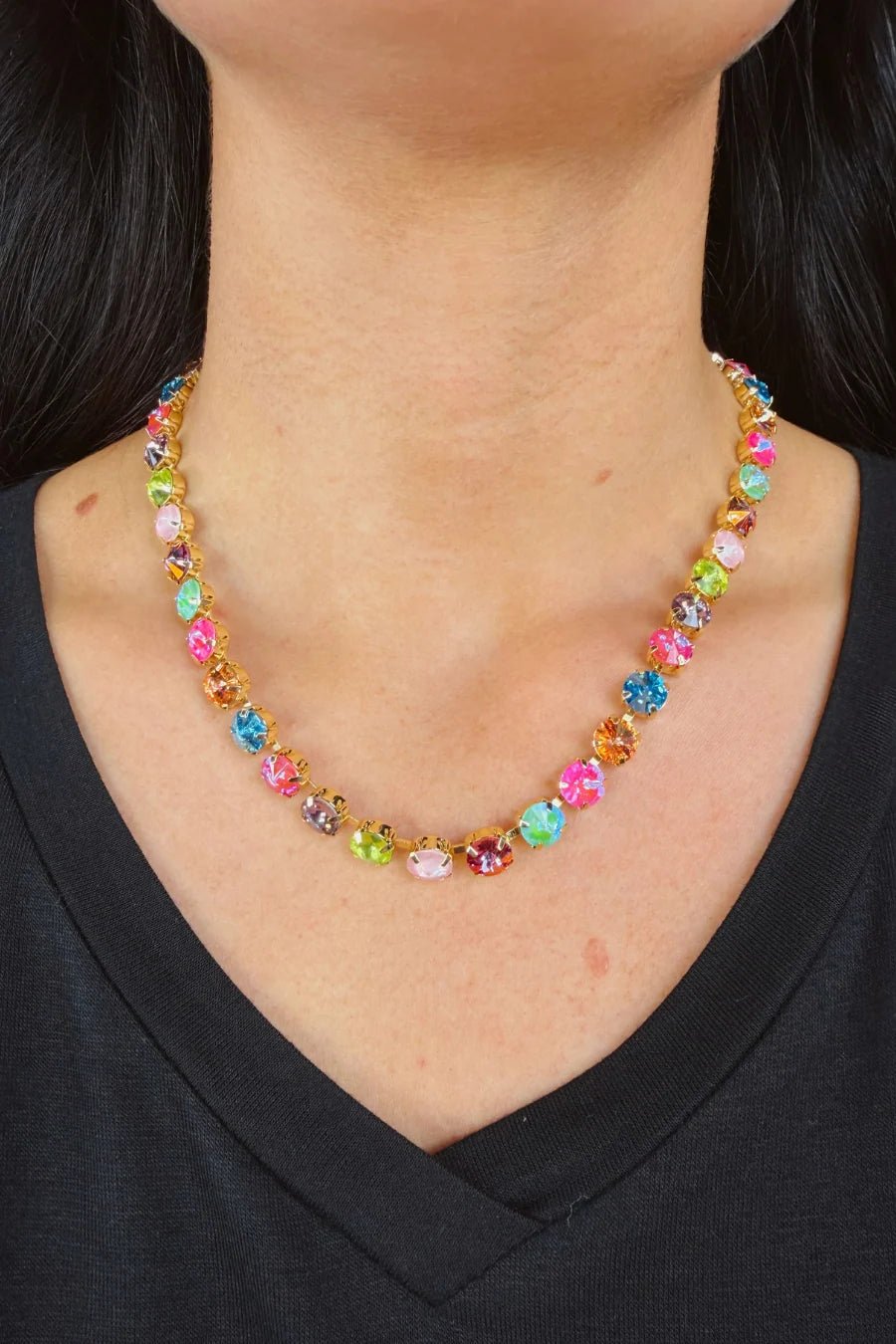 Woman wearing a multicolored gemstones necklace