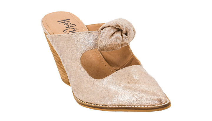 Gold glittery sandal with a bow on a white background