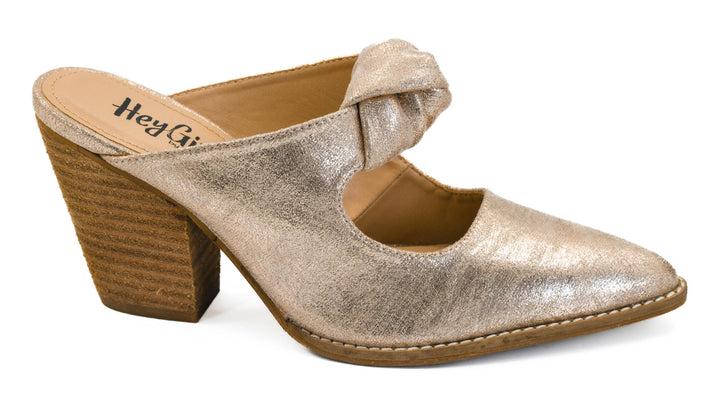 Gold heeled shoe with a wooden sole on a white background