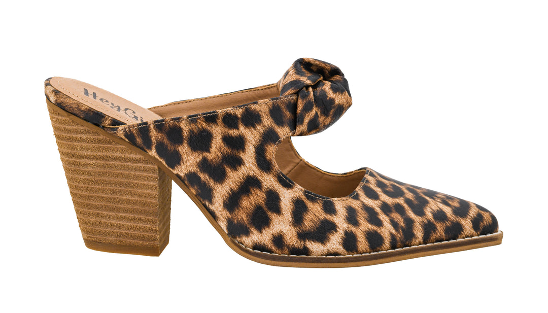 Leopard print high heel shoe with a block heel on a white background