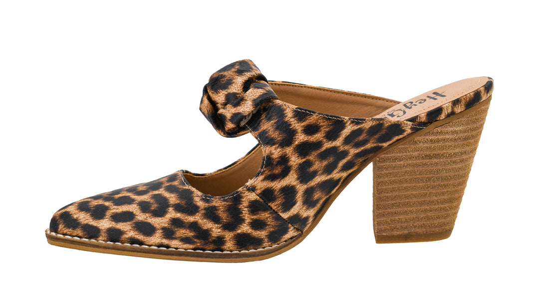 Leopard print shoe with a wooden heel on a white background
