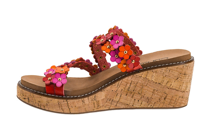 Wedge sandal with floral straps on a white background