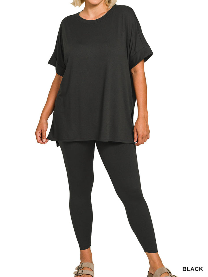 Woman wearing a black outfit on a white background