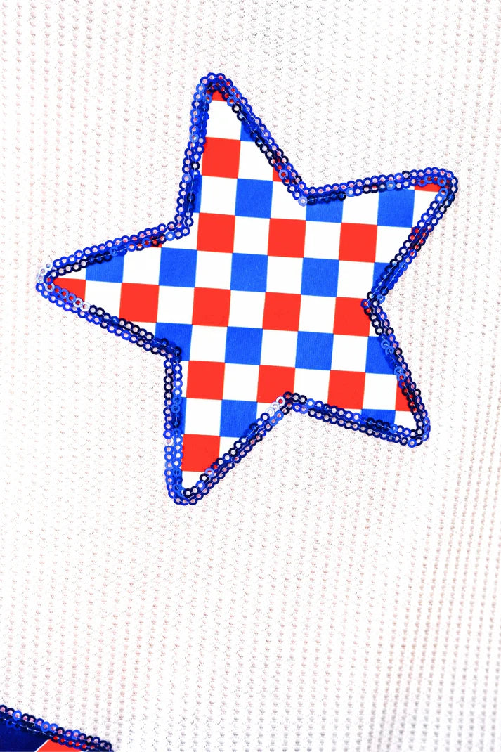 Star-shaped object with red, white, and blue checkered pattern on a white background