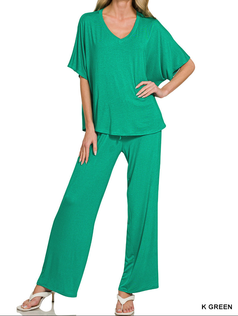 Woman wearing a v-neck oversized top &amp; pants set