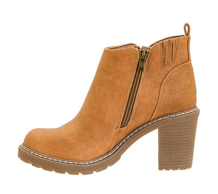 A tan suede ankle boot with a side zipper, block heel, and lug sole, shown from a side profile on a white background.