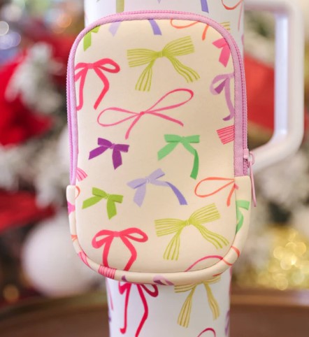 Colorful bow-patterned pouch on a white background