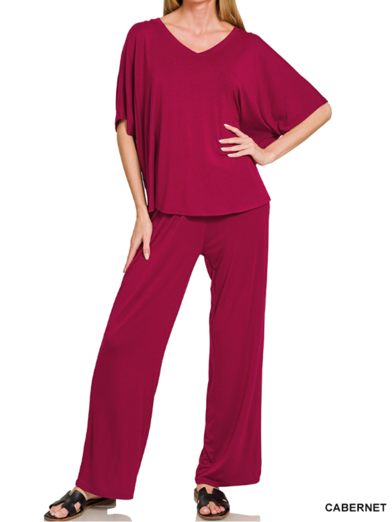 Woman wearing a cabernet colored v-neck loose pants set