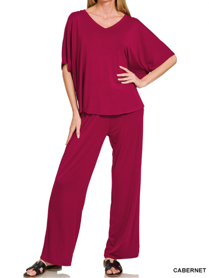 Woman wearing a cabernet colored v-neck loose pants set