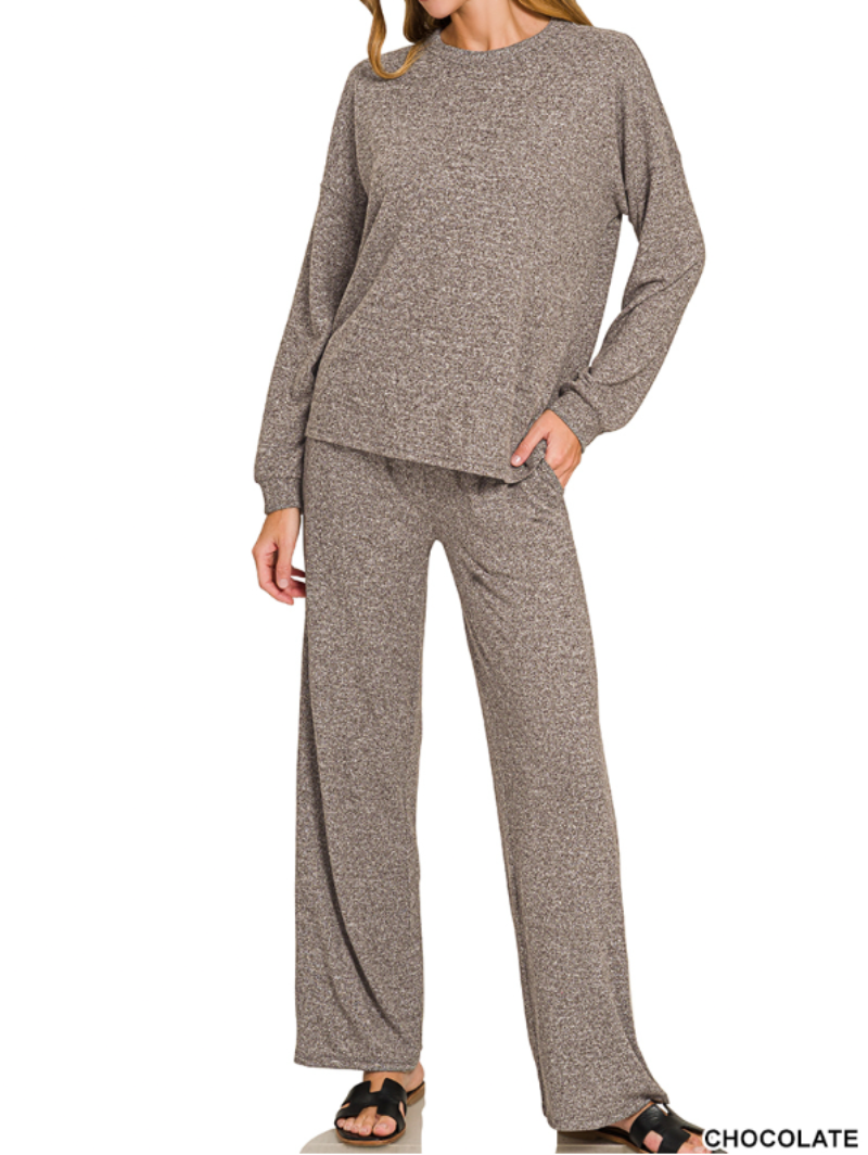 A woman modeling a matching two-piece lounge set consisting of a long-sleeve crewneck sweater and wide-leg pants in a heathered chocolate brown color, shown against a plain white background.