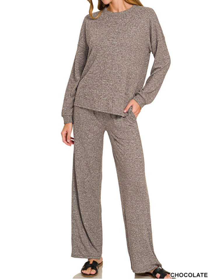 A woman modeling a matching two-piece lounge set consisting of a long-sleeve crewneck sweater and wide-leg pants in a heathered chocolate brown color, shown against a plain white background.