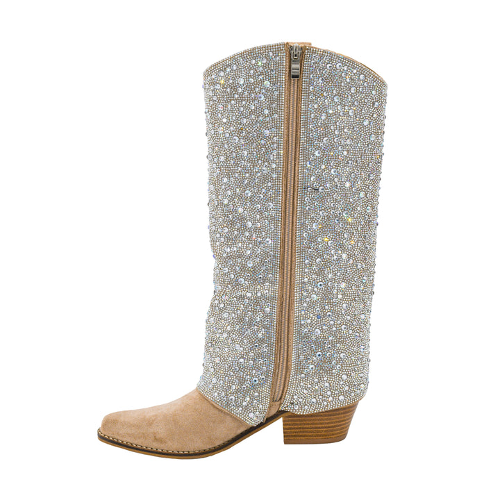 A single western-style cowboy boot with a beige suede foot and stacked block heel, covered in sparkling rhinestone embellishments on the shaft, and featuring a central zipper, shown against a plain white background.