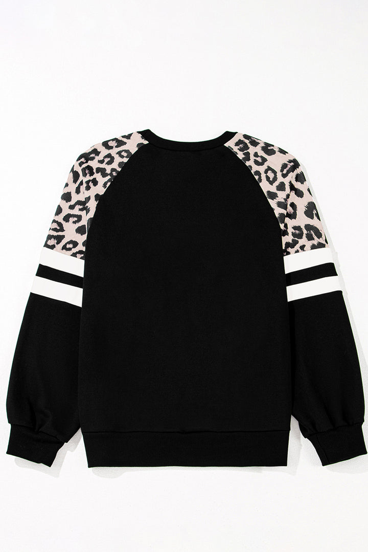 Black sweatshirt with leopard print sleeves on a white background