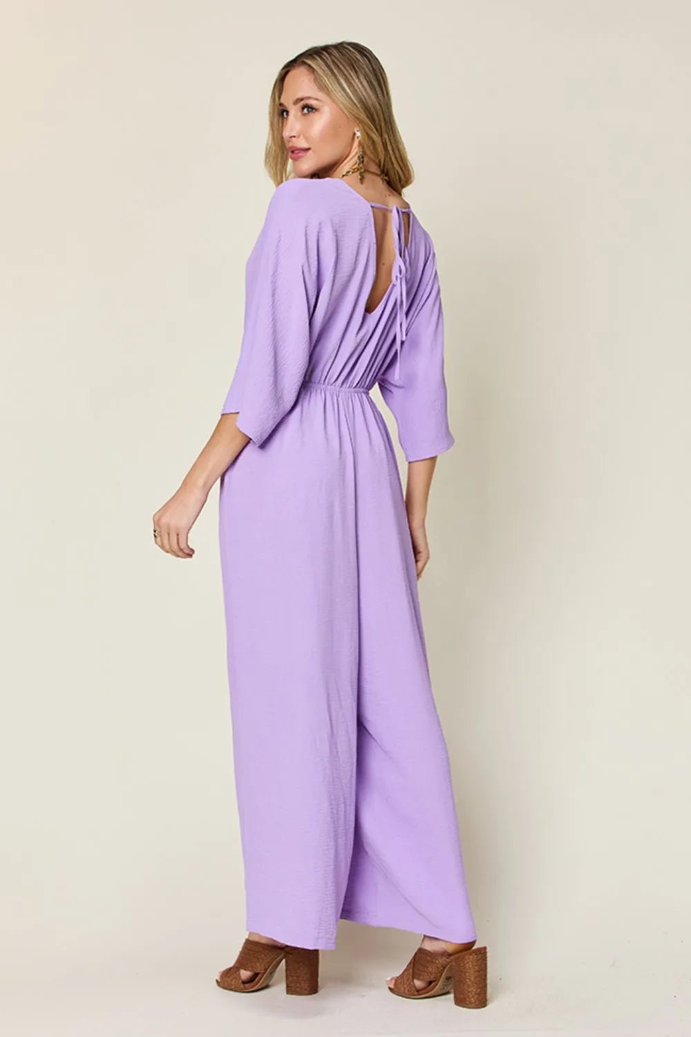 Double Take Full Size Surplice Wide Leg Jumpsuit with Pockets | Nikki &amp; Co. Boutique