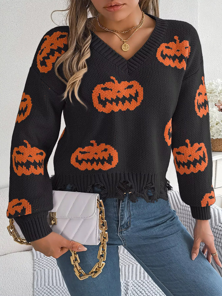 Women wearing black sweater with pumpkins on it while holding a clutch