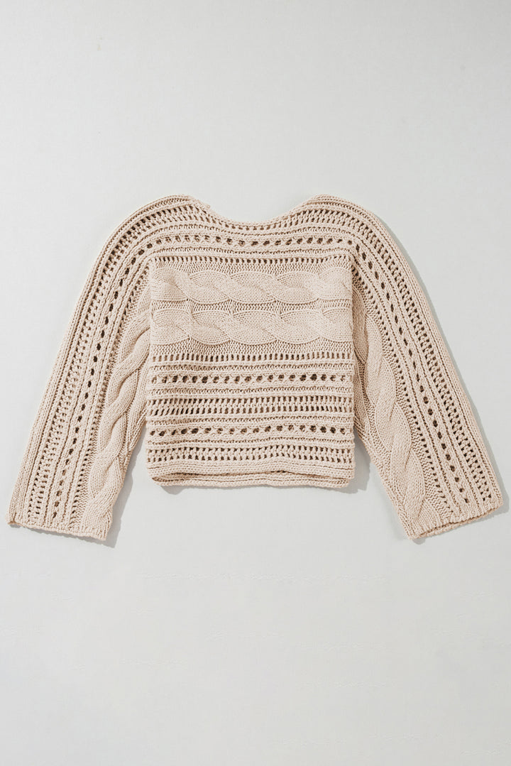 Beige knitted sweater on a light gray background