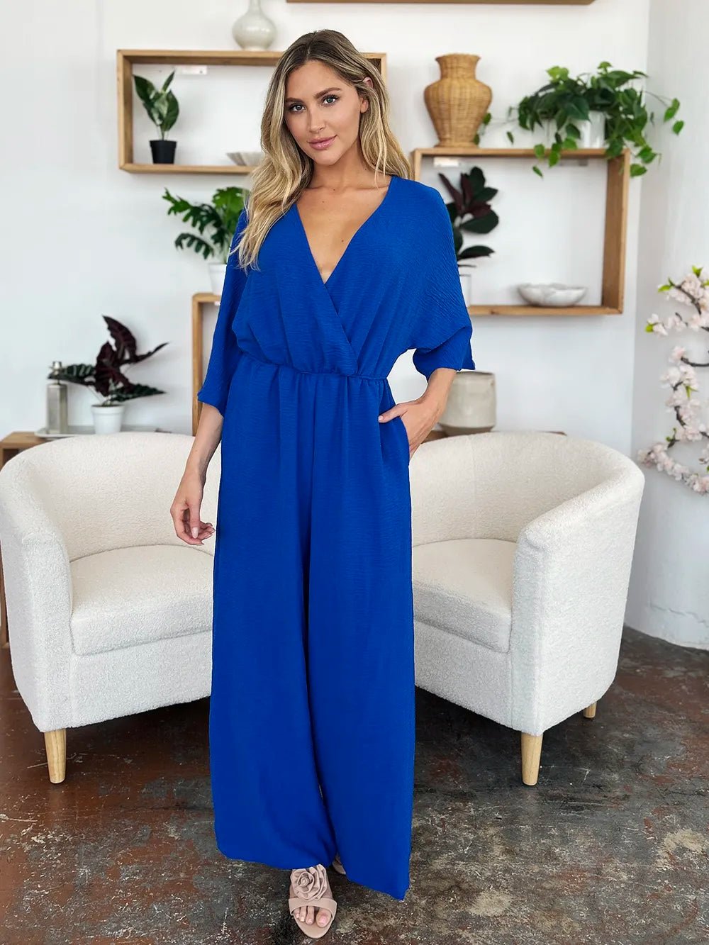 Double Take Full Size Surplice Wide Leg Jumpsuit with Pockets | Nikki &amp; Co. Boutique