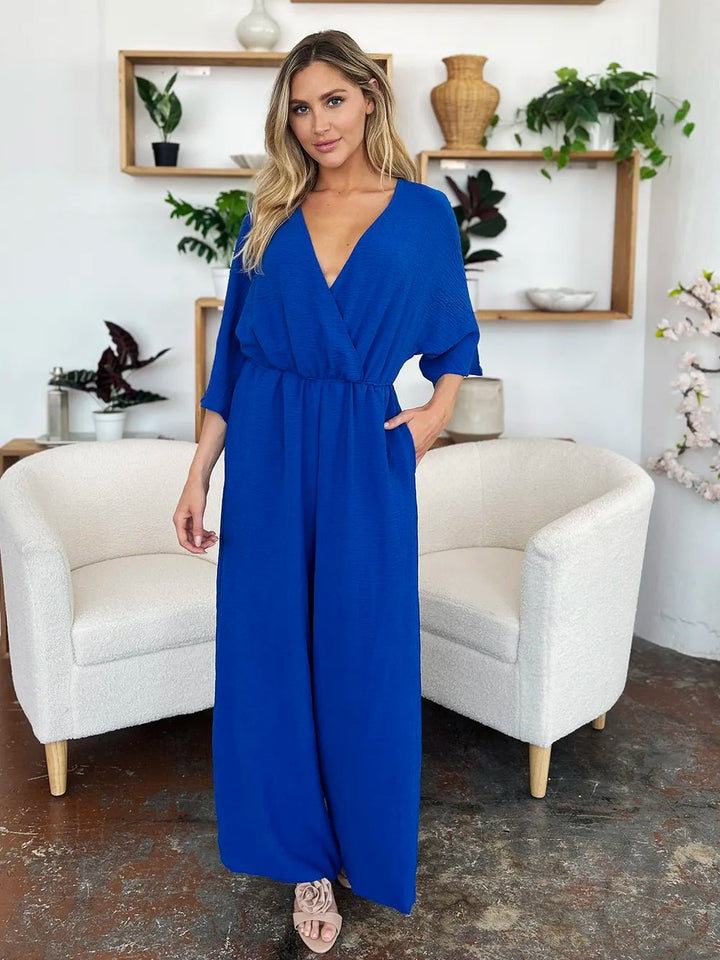 Double Take Full Size Surplice Wide Leg Jumpsuit with Pockets | Nikki &amp; Co. Boutique