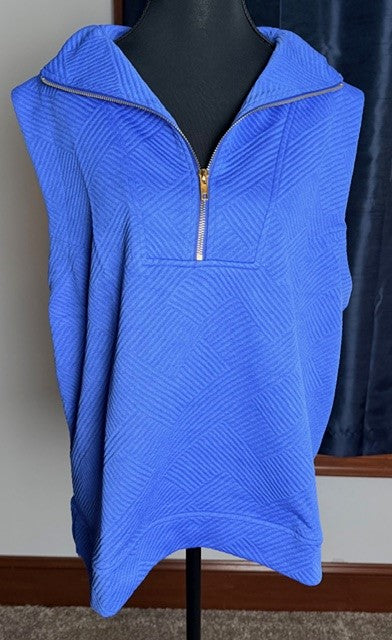 Blue zip-up sleeveless jacket on a mannequin against a neutral background