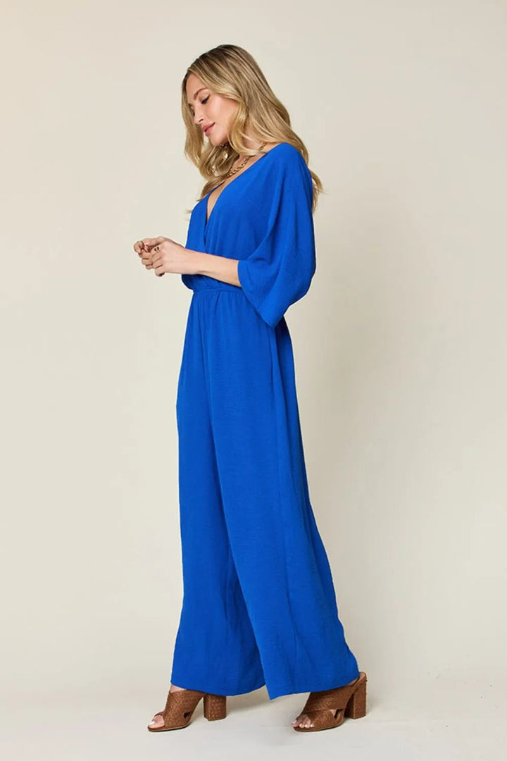 Double Take Full Size Surplice Wide Leg Jumpsuit with Pockets | Nikki &amp; Co. Boutique
