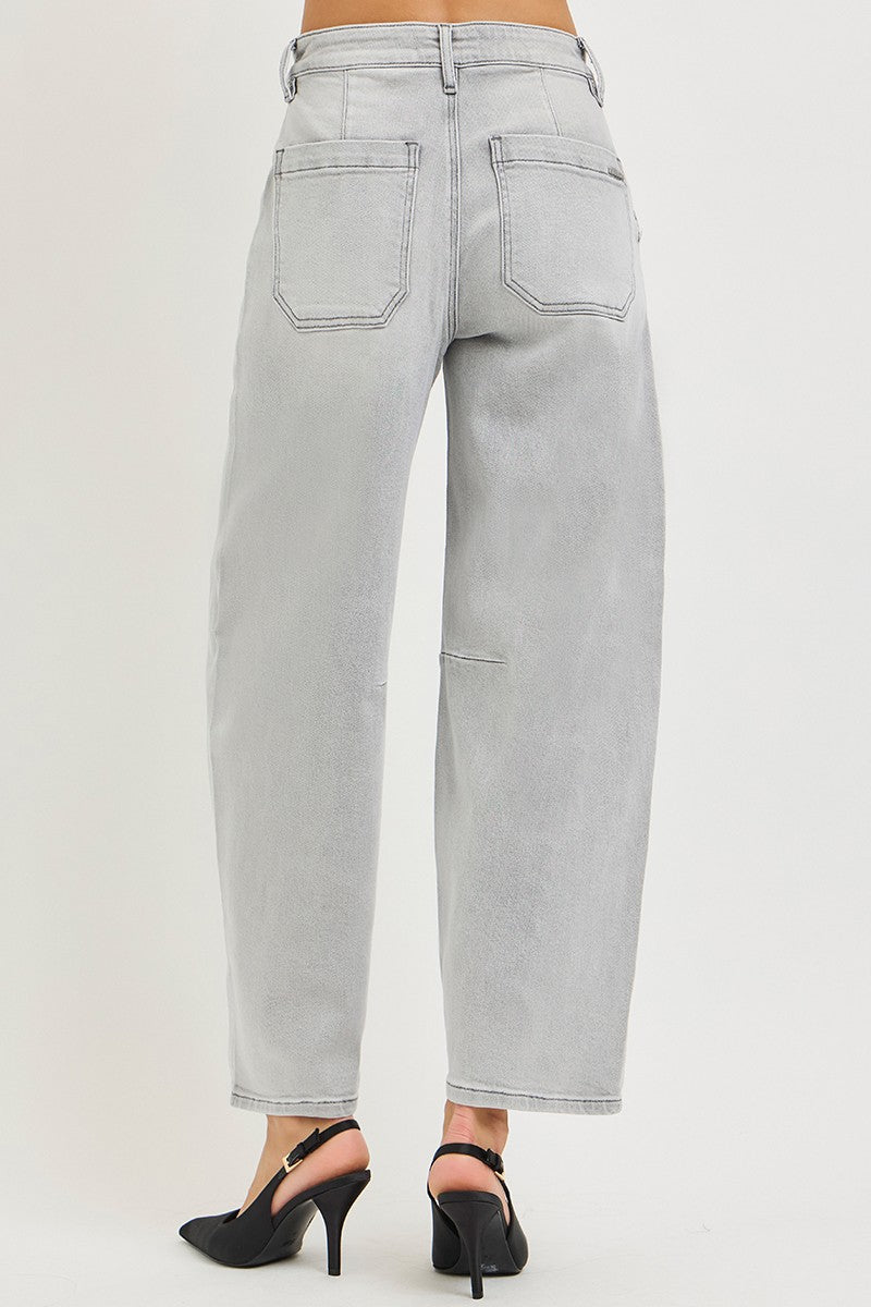 Light gray jeans worn by a person on a white background