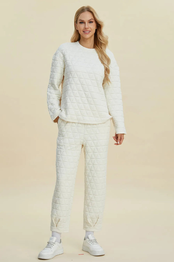 Woman wearing a quilted white outfit on a beige background