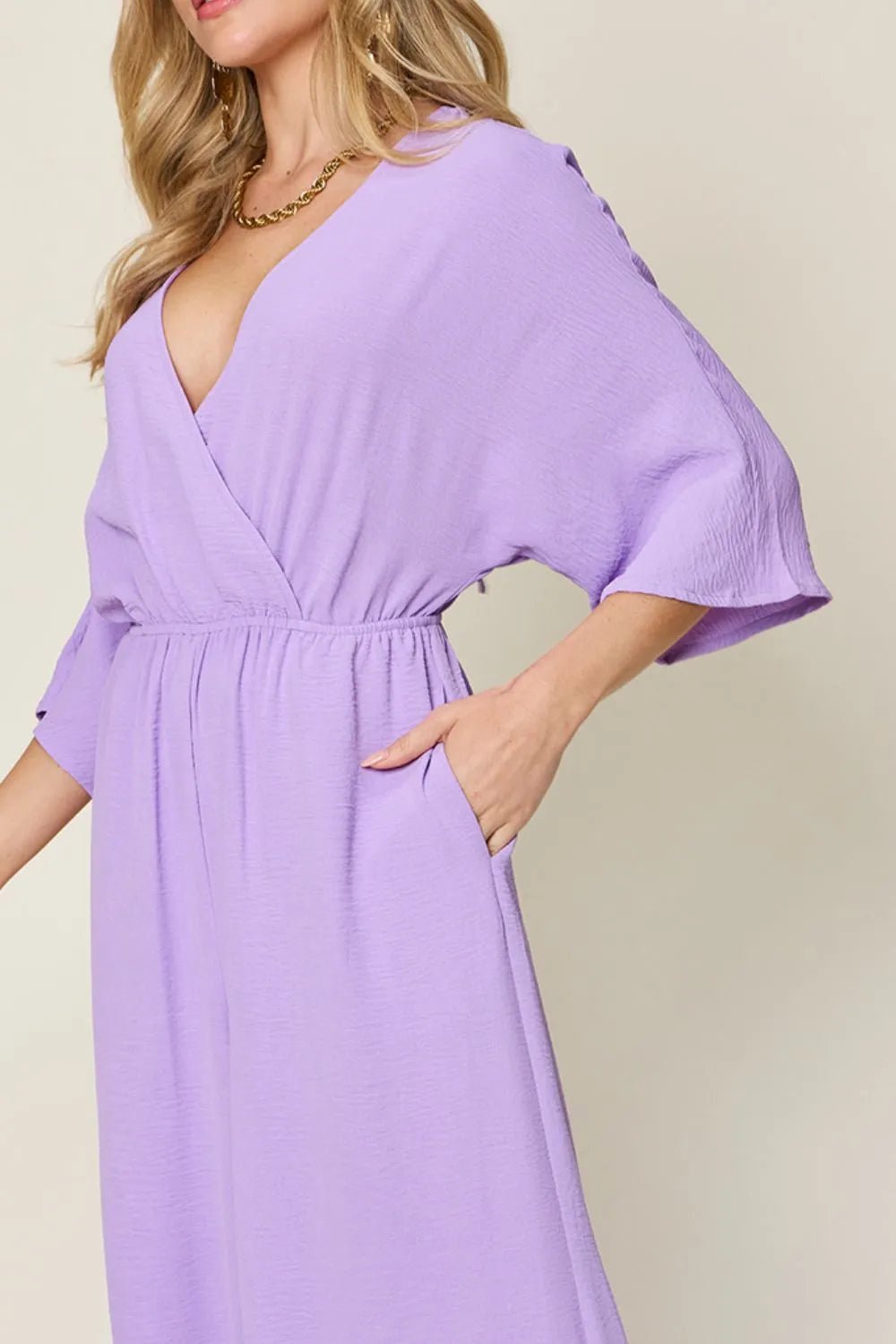Double Take Full Size Surplice Wide Leg Jumpsuit with Pockets | Nikki &amp; Co. Boutique
